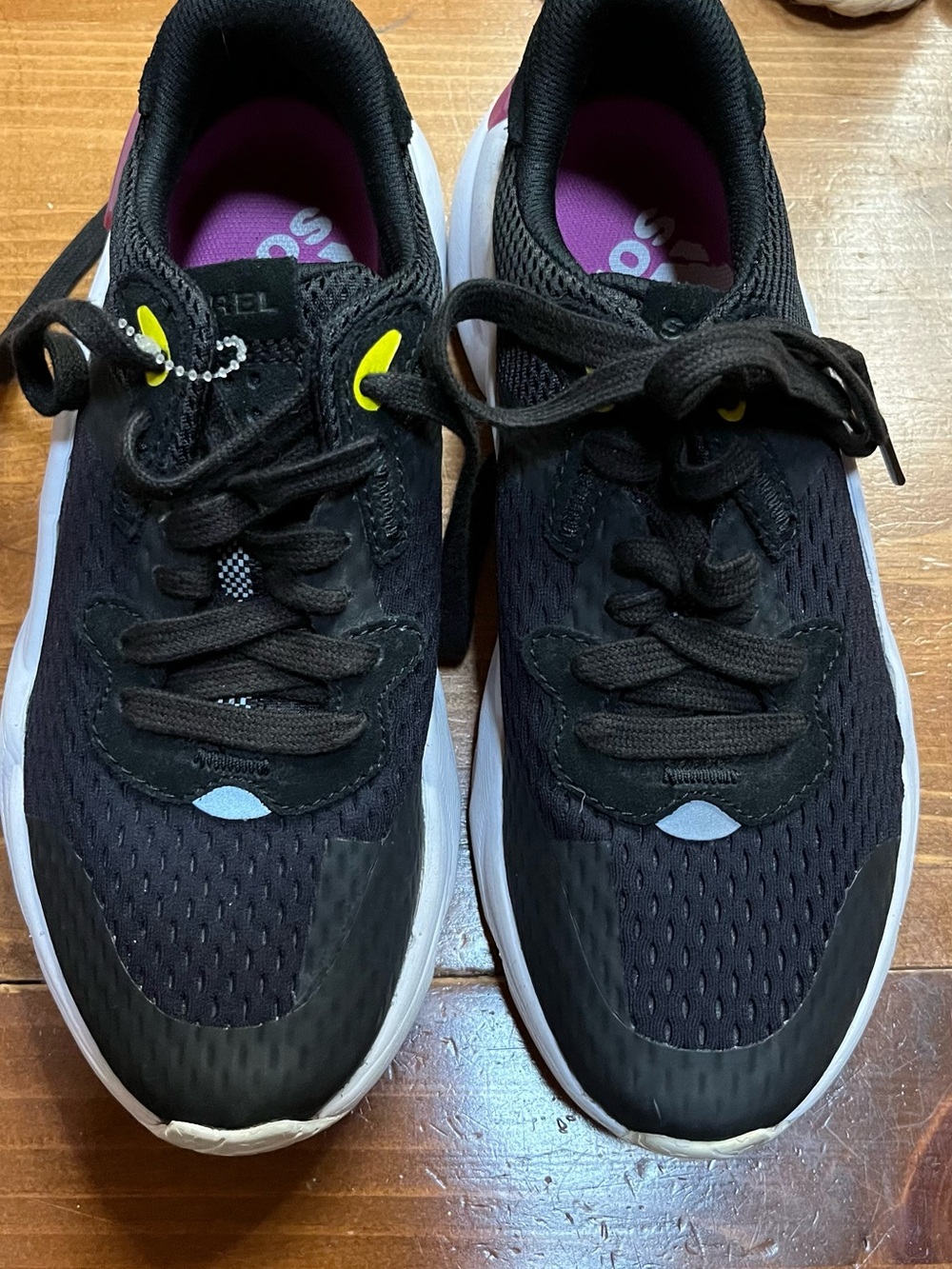 Sorel Women's Black Athletic Sneakers with Purple Insole and Yellow Eyelets
